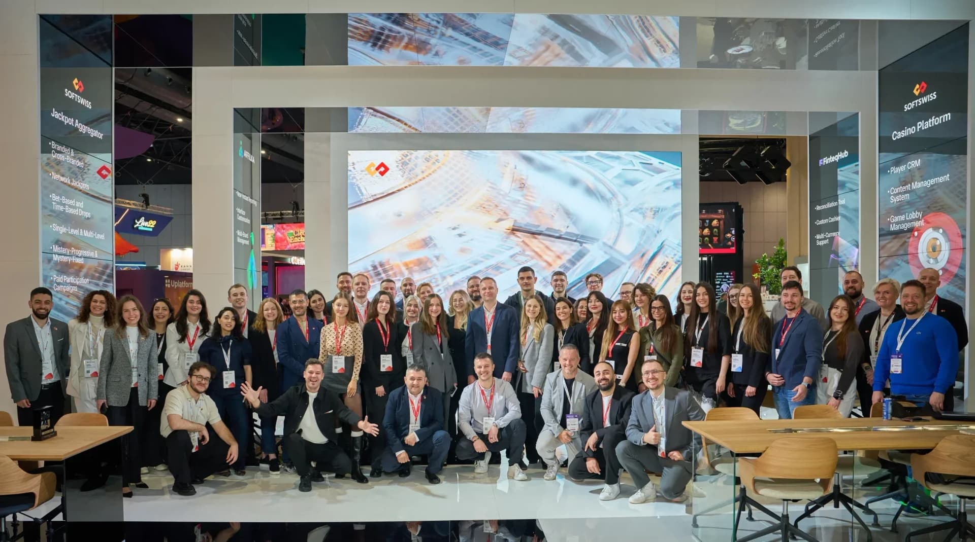 SOFTSWISS team showcases technology solutions at transparent exhibition booth